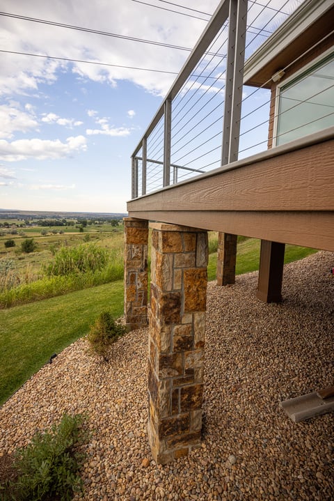 Residential landscape design back of house metal railing 1