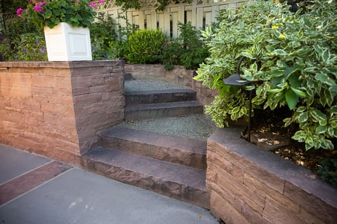 Residential landscape design with retaining wall and landscape beds 1