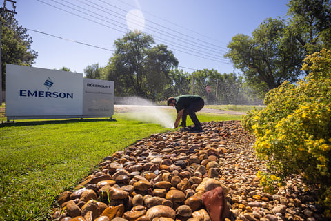 commercial maintenance irrigation system crew making adjustments