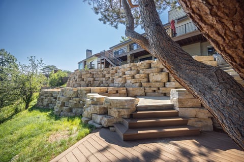 residential landscape design boulder retaining wall and steps 4