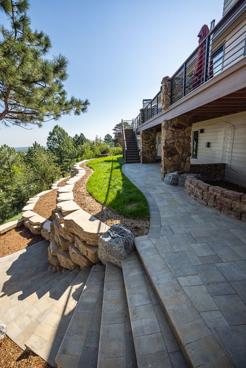 residential landscape design boulder retaining wall steps and deck 2