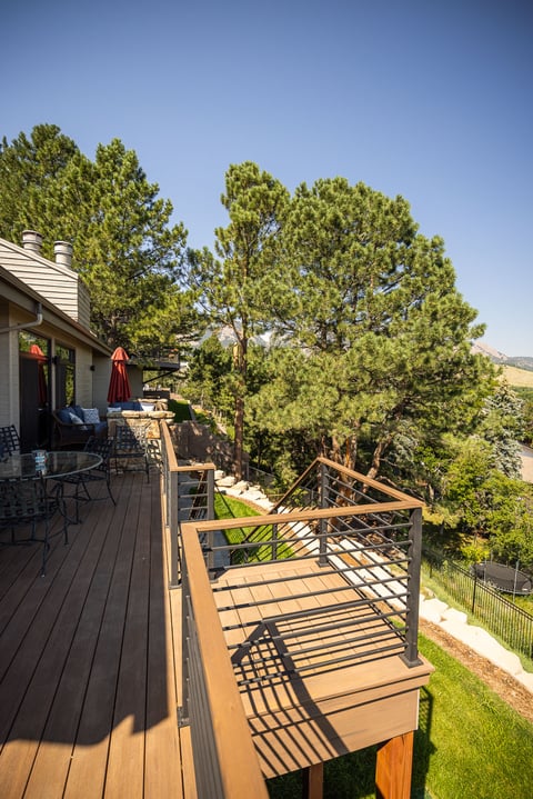 residential landscape design deck with steps metal railing