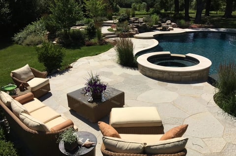 backyard pool and spa with large seating area